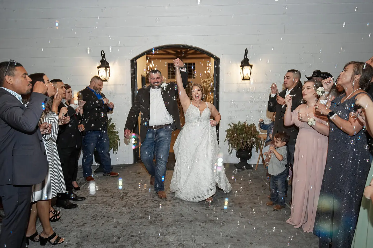 Bride And Groom Grand Exit. Bride Wearing Boho Princess A-line Wedding Dress Called Roxanne By Sottero And Midgley