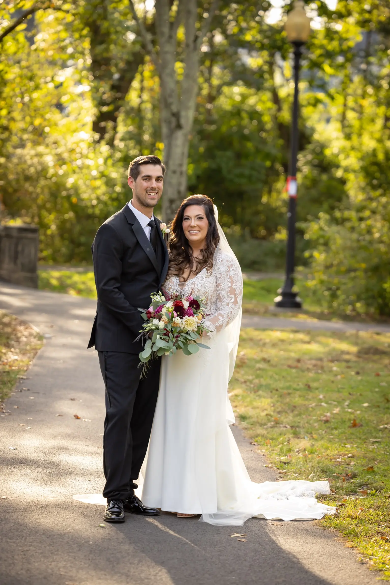 Groom With Bride Wearing Long Sleeve Sheath Wedding Dress Althea By Maggie Sottero