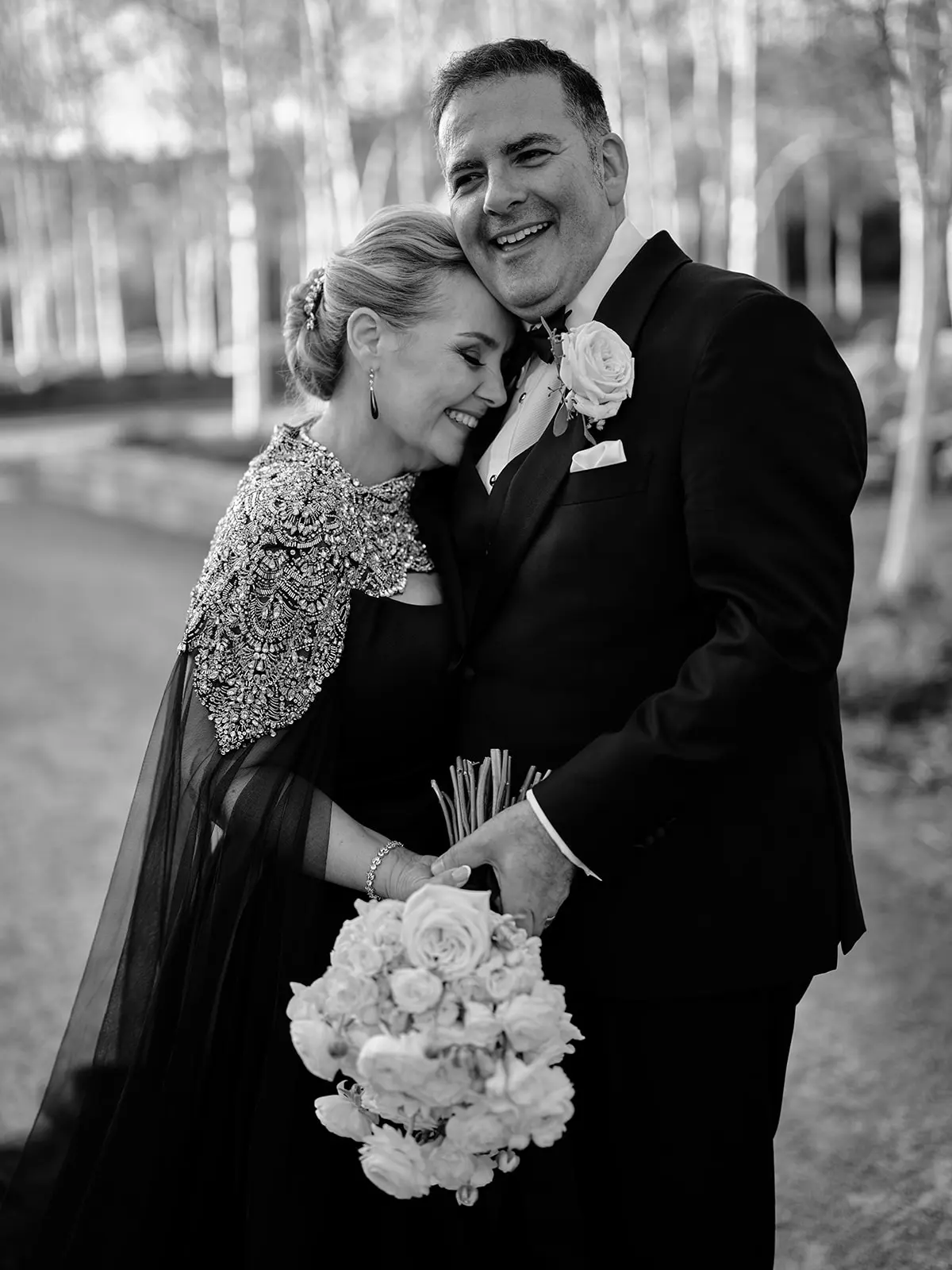Bride wearing Aspen by Sottero and Midgley hugging her husband