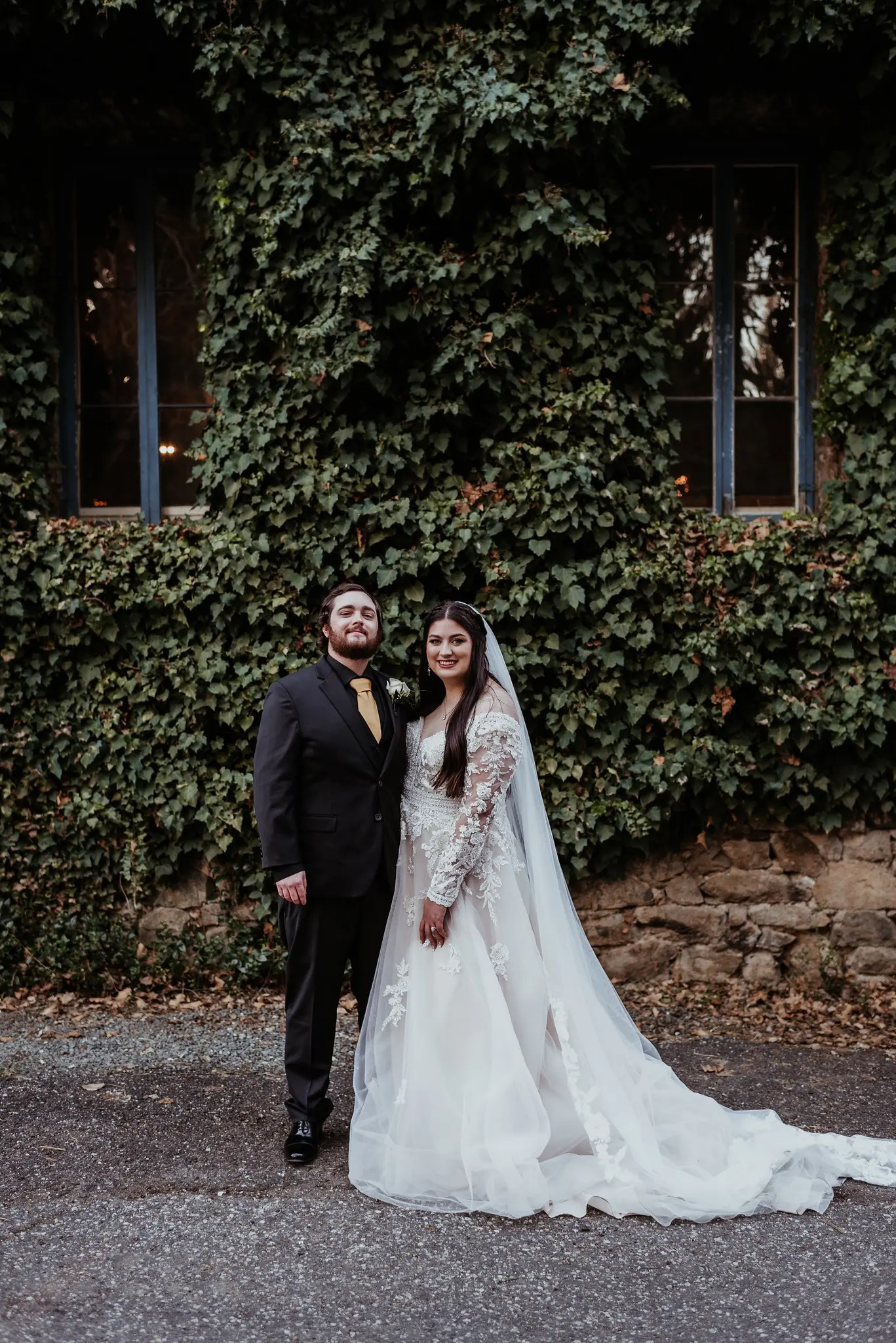 Real Bride wearing long sleeve A-Line wedding dress called Raphael by Maggie Sottero.