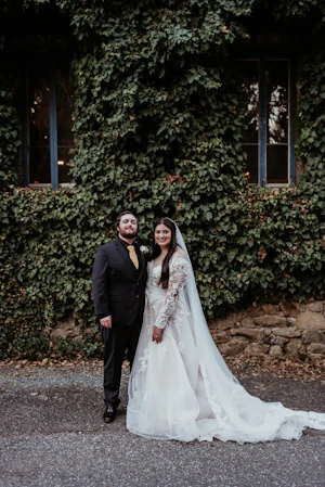 Real Bride wearing long sleeve A-Line wedding dress called Raphael by Maggie Sottero.