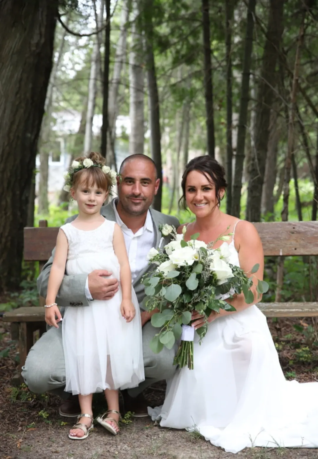 Bride Wearing Simple Chiffon Wedding Dress Called Marta Lynette By Rebecca Ingram With Groom And Flower Girl
