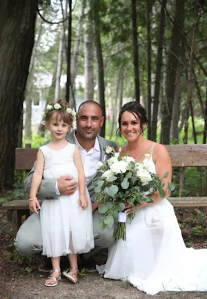 Bride Wearing Simple Chiffon Wedding Dress Called Marta Lynette By Rebecca Ingram With Groom And Flower Girl