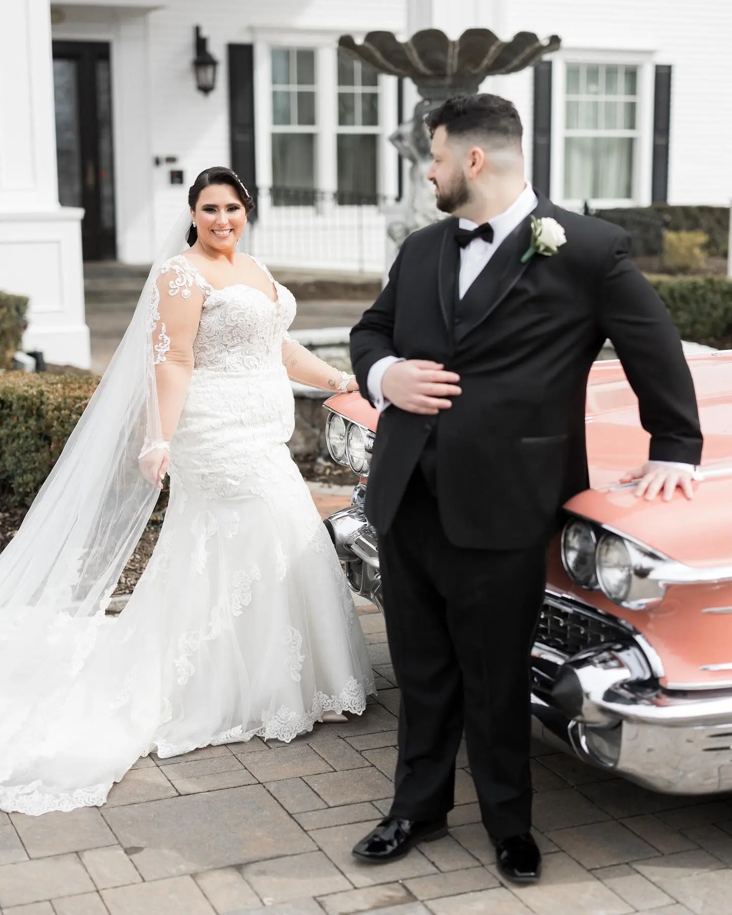 Bride Wearing Sexy Lace Long Sleeve Wedding Dress Called Fiona By Maggie Sottero With Groom Looking At Her