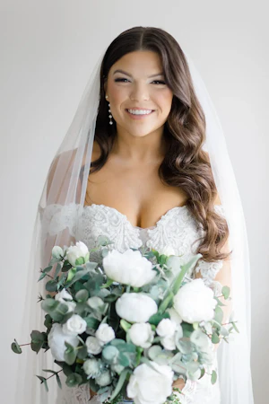 Bride Holding Flowers Wearing A Dress Called Fiona By Maggie Sottero
