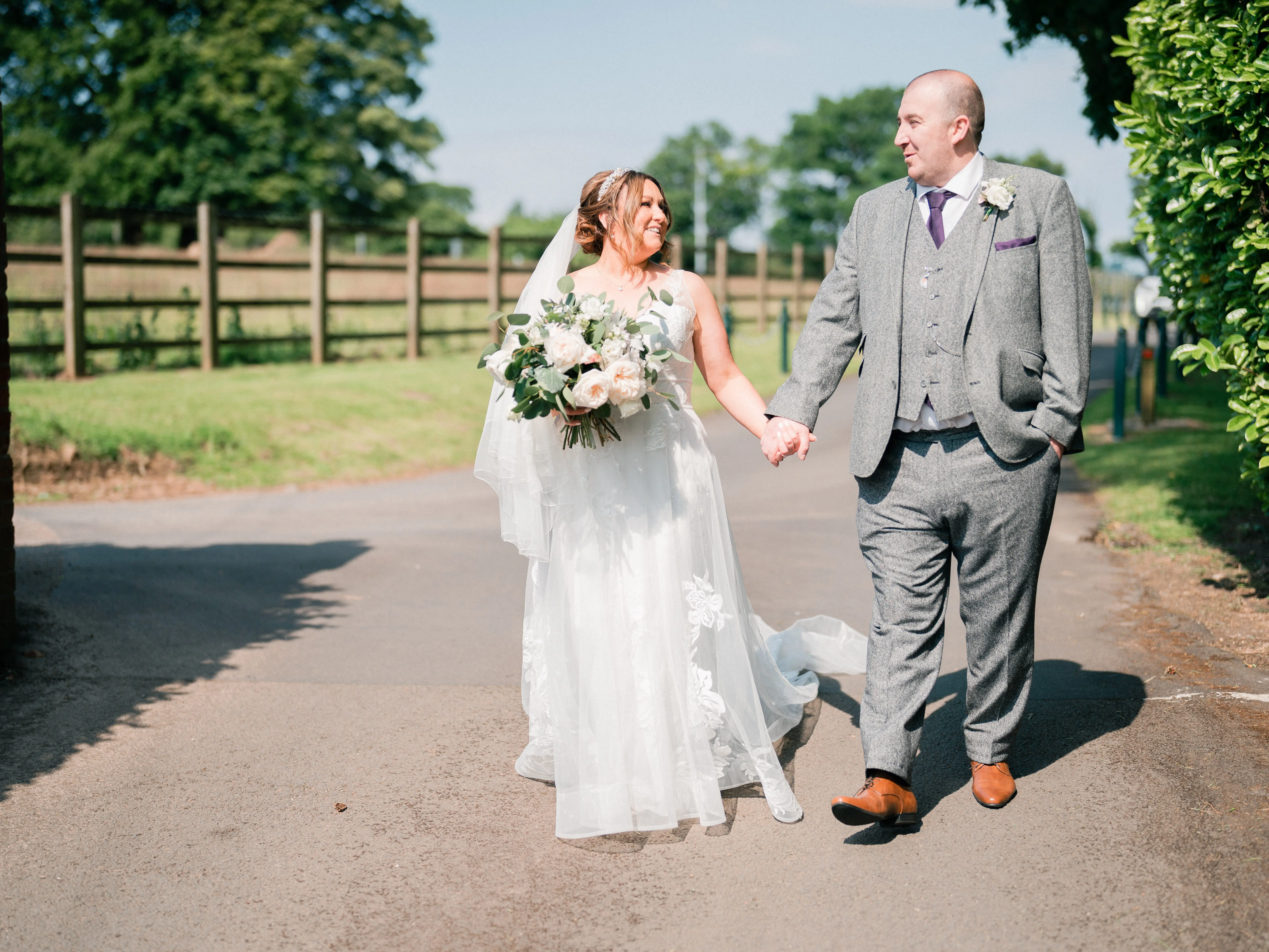 Real Bride in A-Line Wedding Gown with Lace Motifs Over Tulle and Beaded Lace Bodice Embellished with Swarovski Crystals Called Priscilla by Rebecca Ingram