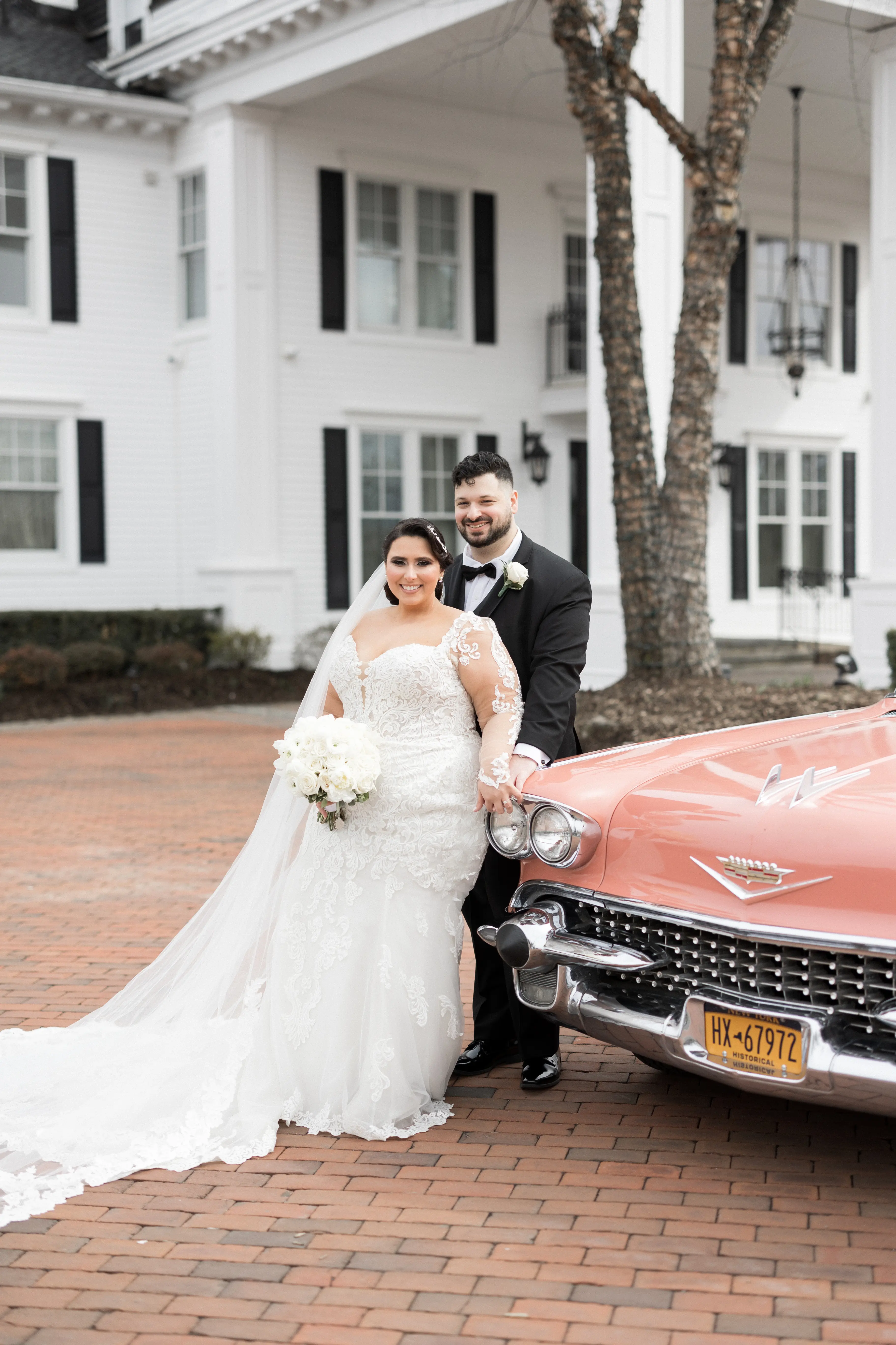 Bride Wearing Sexy Lace Long Sleeve Wedding Dress Called Fiona By Maggie Sottero With Groom Next To Vintage Car