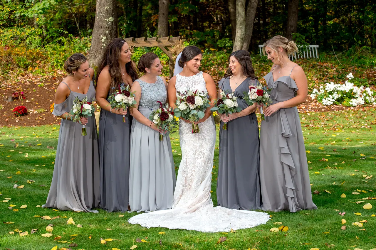 Bride wearing Lace Sheath Wedding Dress called Kevyn by Sottero and Midgley and her bridal party in gray dresses