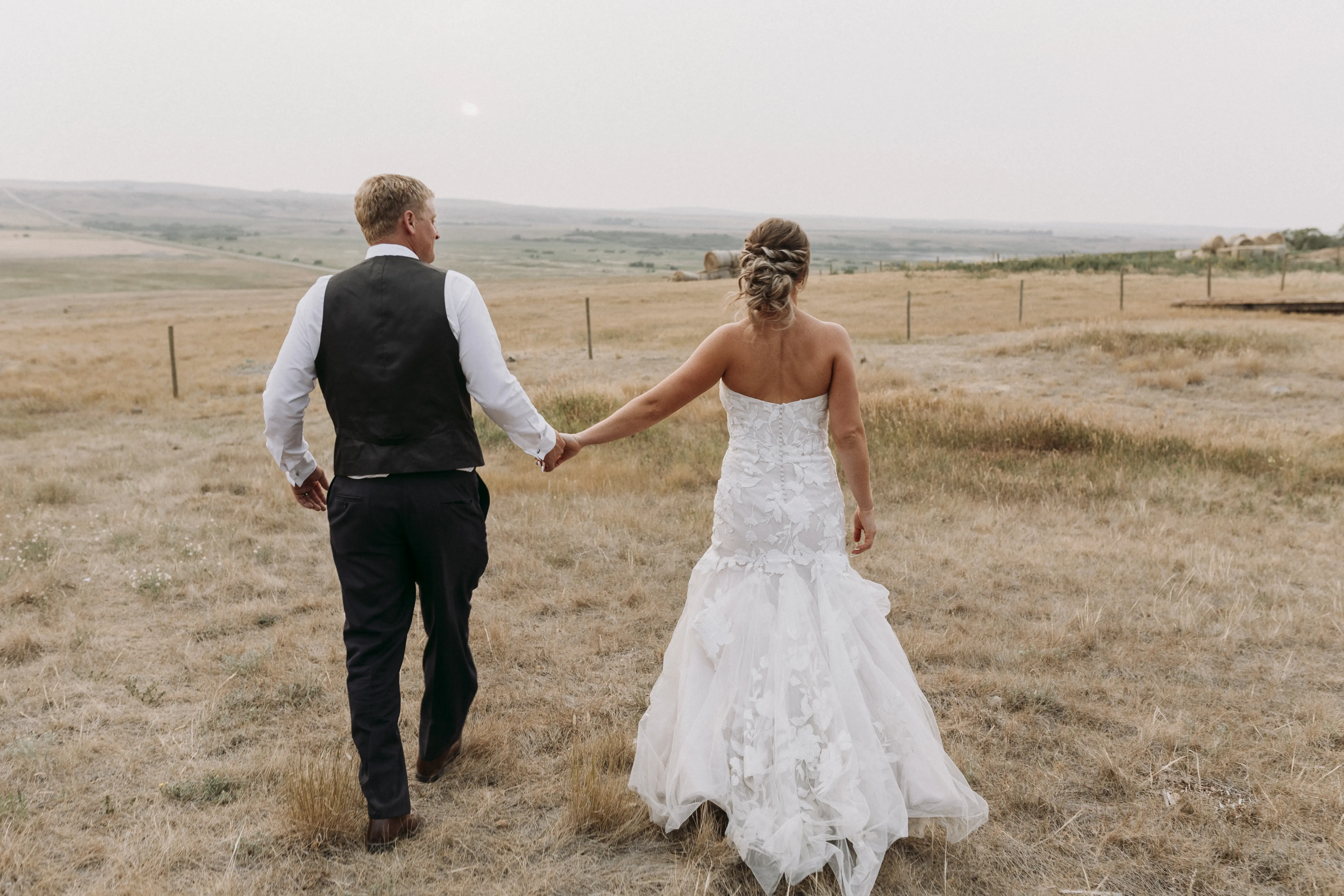 Bride with groom wearing strapless mermaid wedding dress