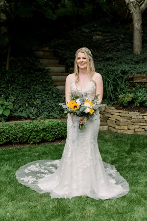 Bride in Floral Fit-and-Flare Wedding Dress Decked Out in Garden-Inspired Lace called Greenley by Maggie Sottero