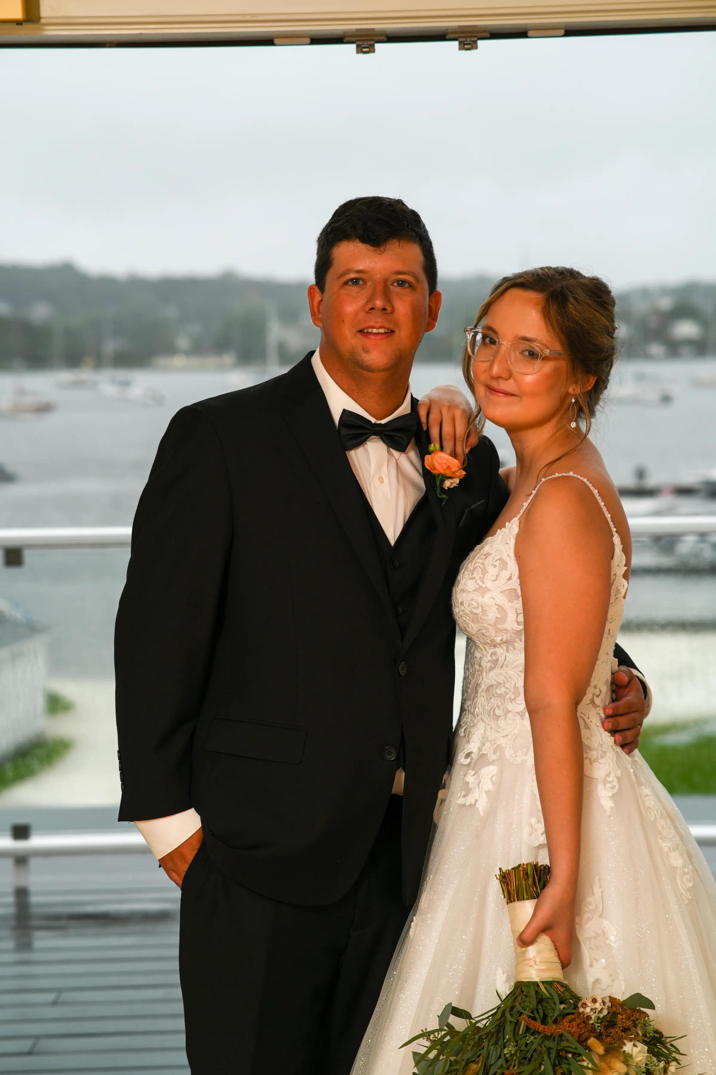 Bride wearing Florence wedding dress by Maggie Sottero with her husband