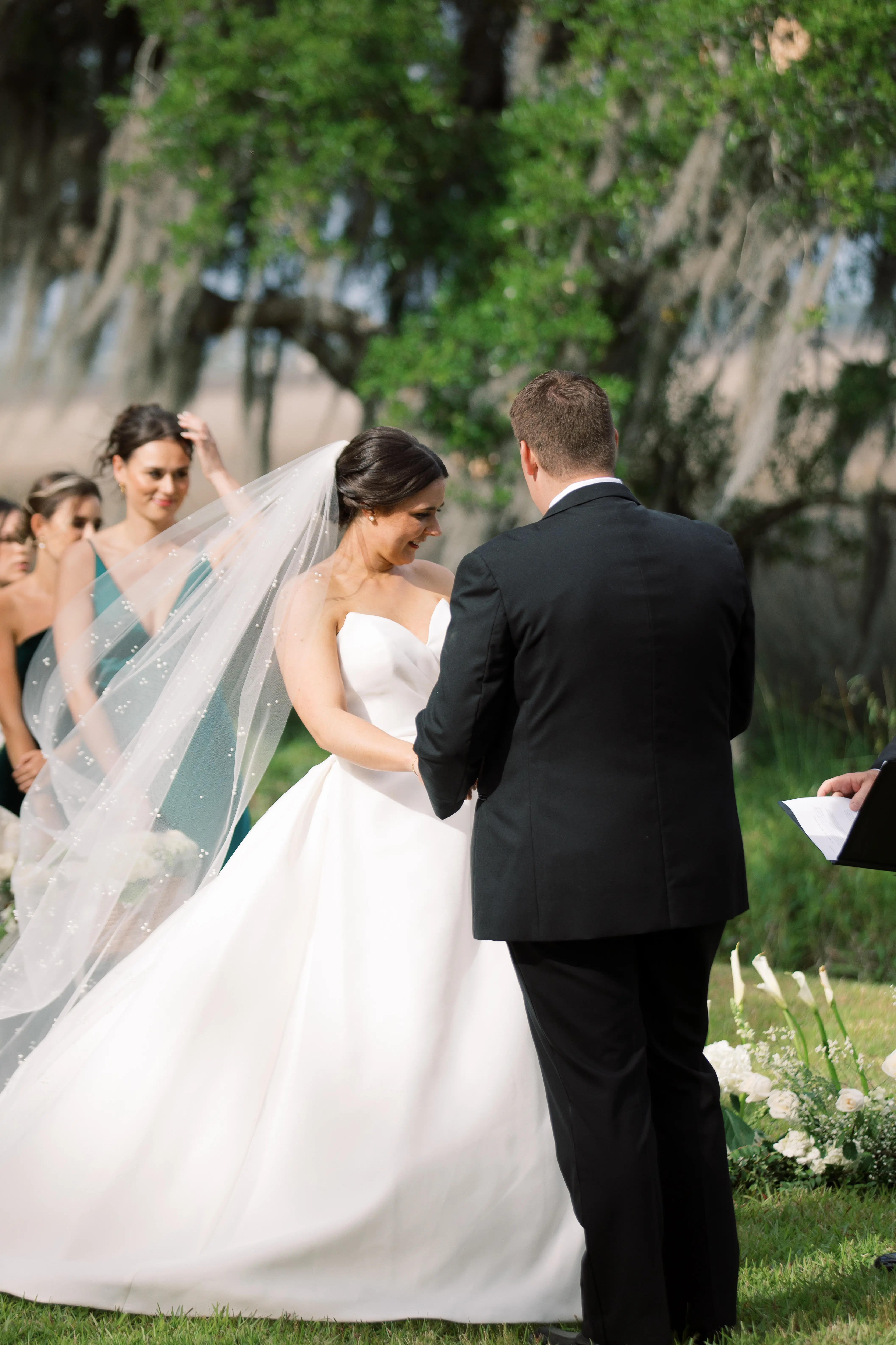 Bride wearing Nisha by Maggie Sottero being married during her ceremony