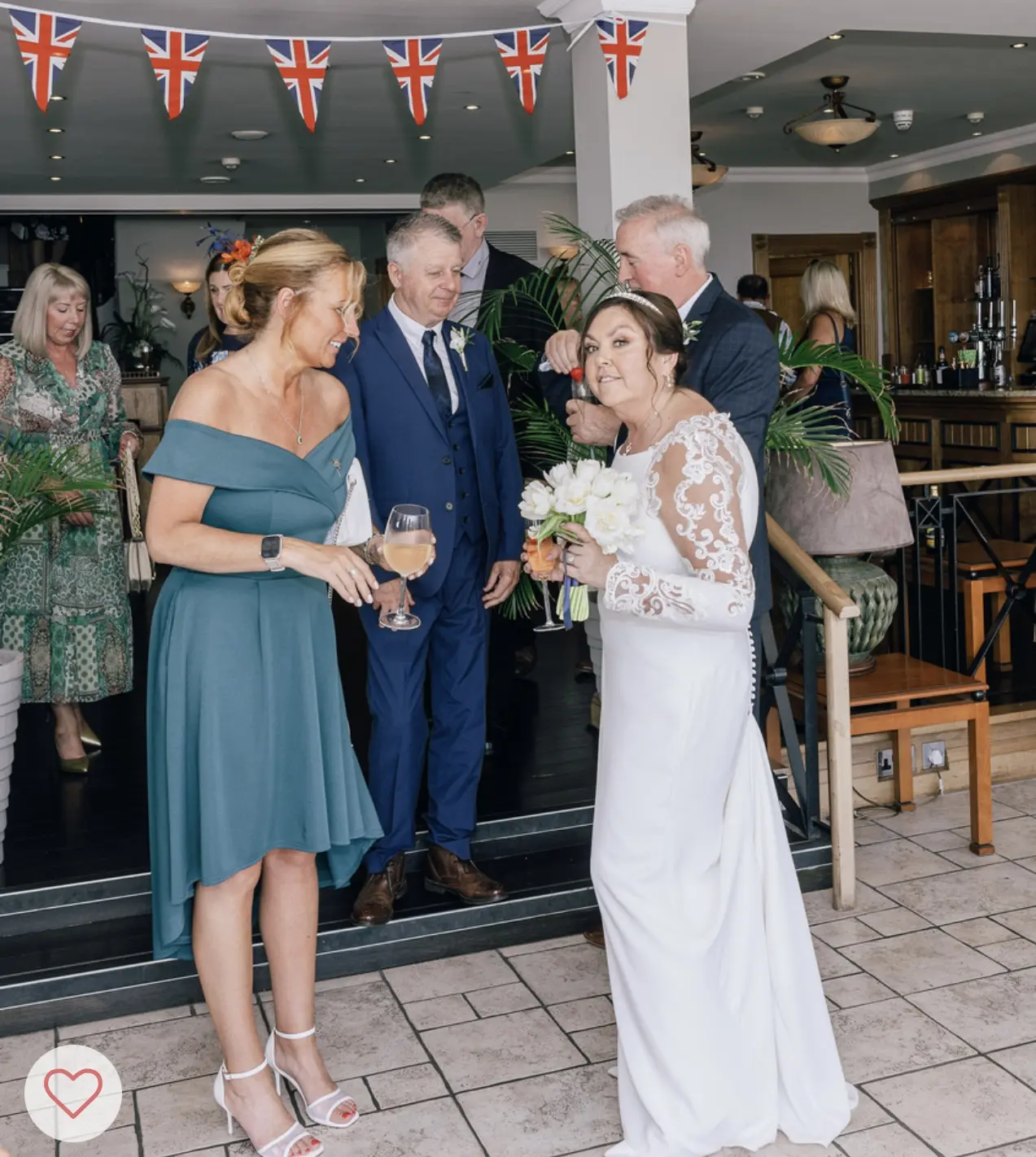 Bride in Crepe Long Sleeve Lace Sheath Wedding Dress named Bethany by Rebecca Ingram Bride at Reception