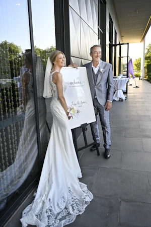 Bride wearing Audrina by Maggie Sottero wiith her husband