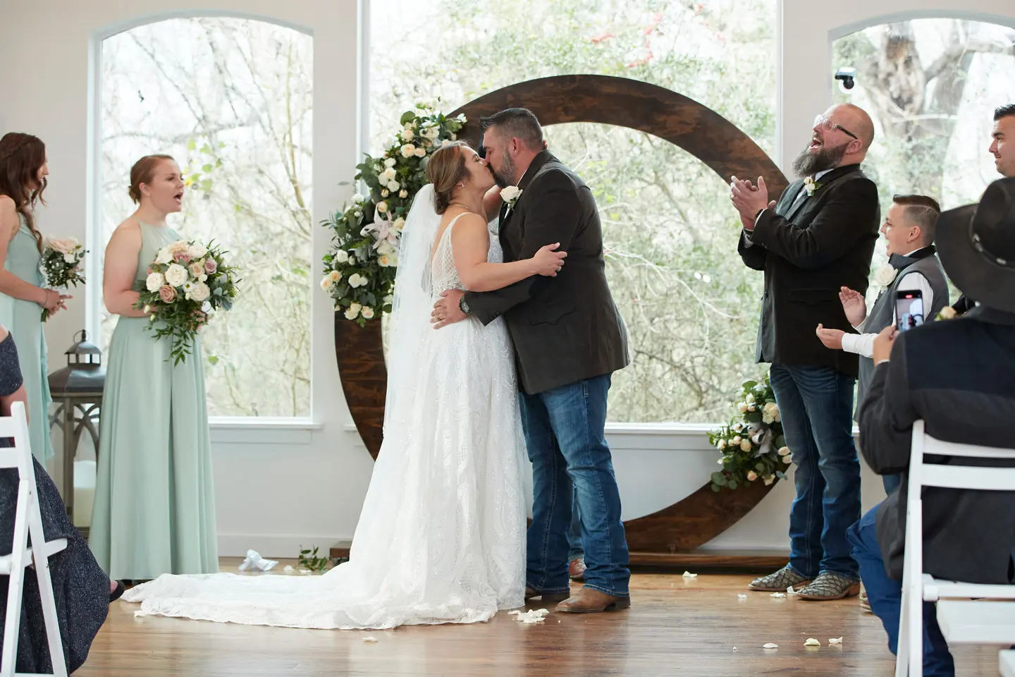 Bride And Groom Share First Kiss. Bride Wearing Boho Princess A-line Wedding Dress Called Roxanne By Sottero And Midgley
