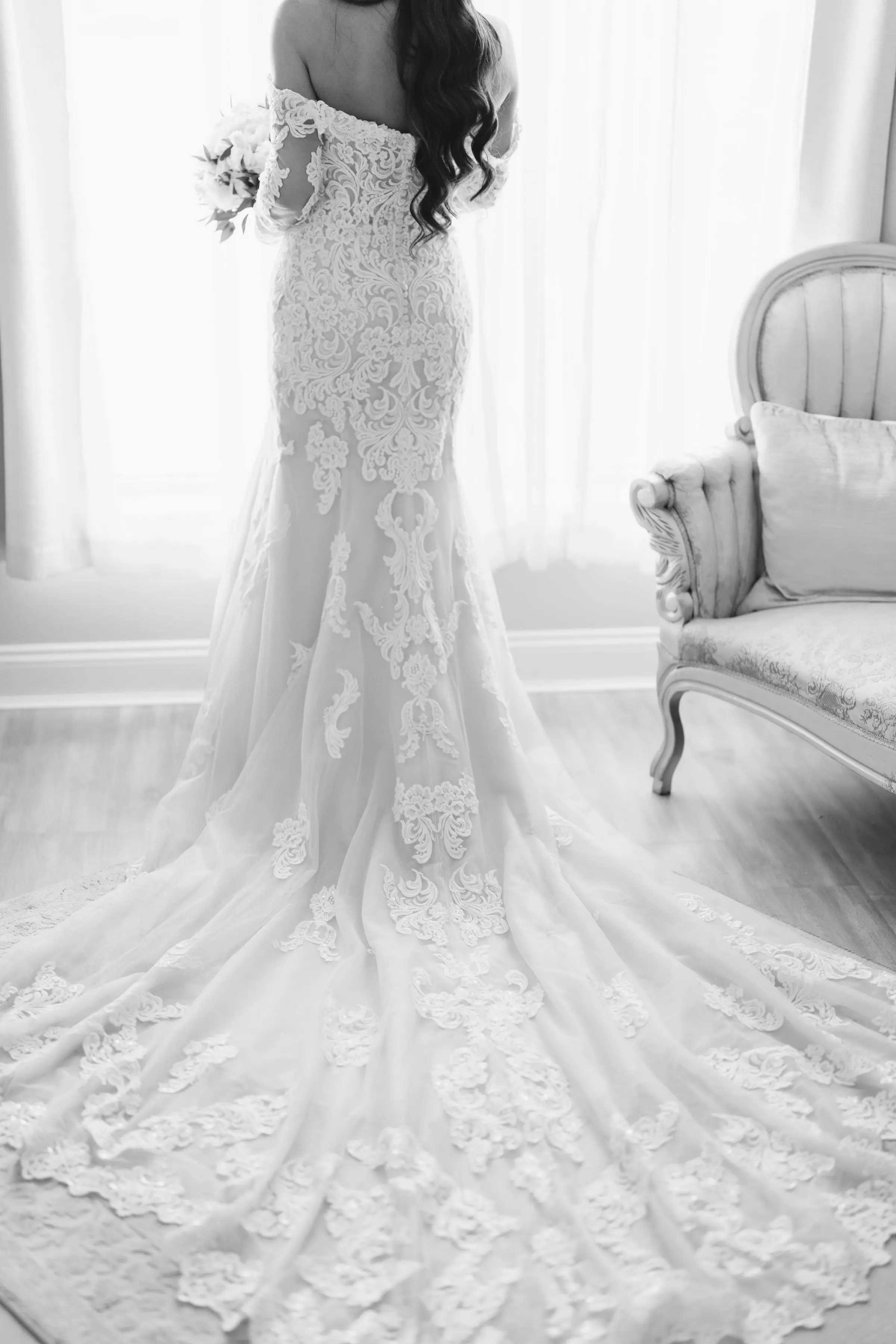 Bride Wearing Sparkly Lace Fit-and-Flare Wedding Dress Indoors.