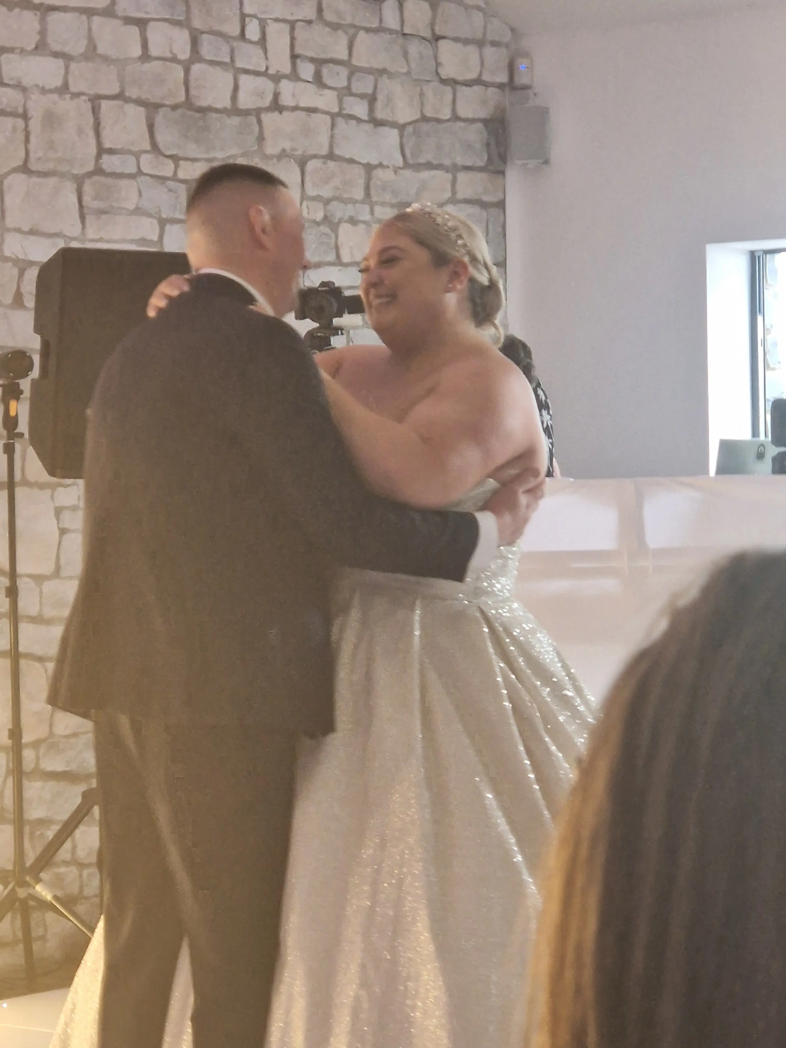 Bride wearing Anniston by Maggie Sottero dancing with her husband