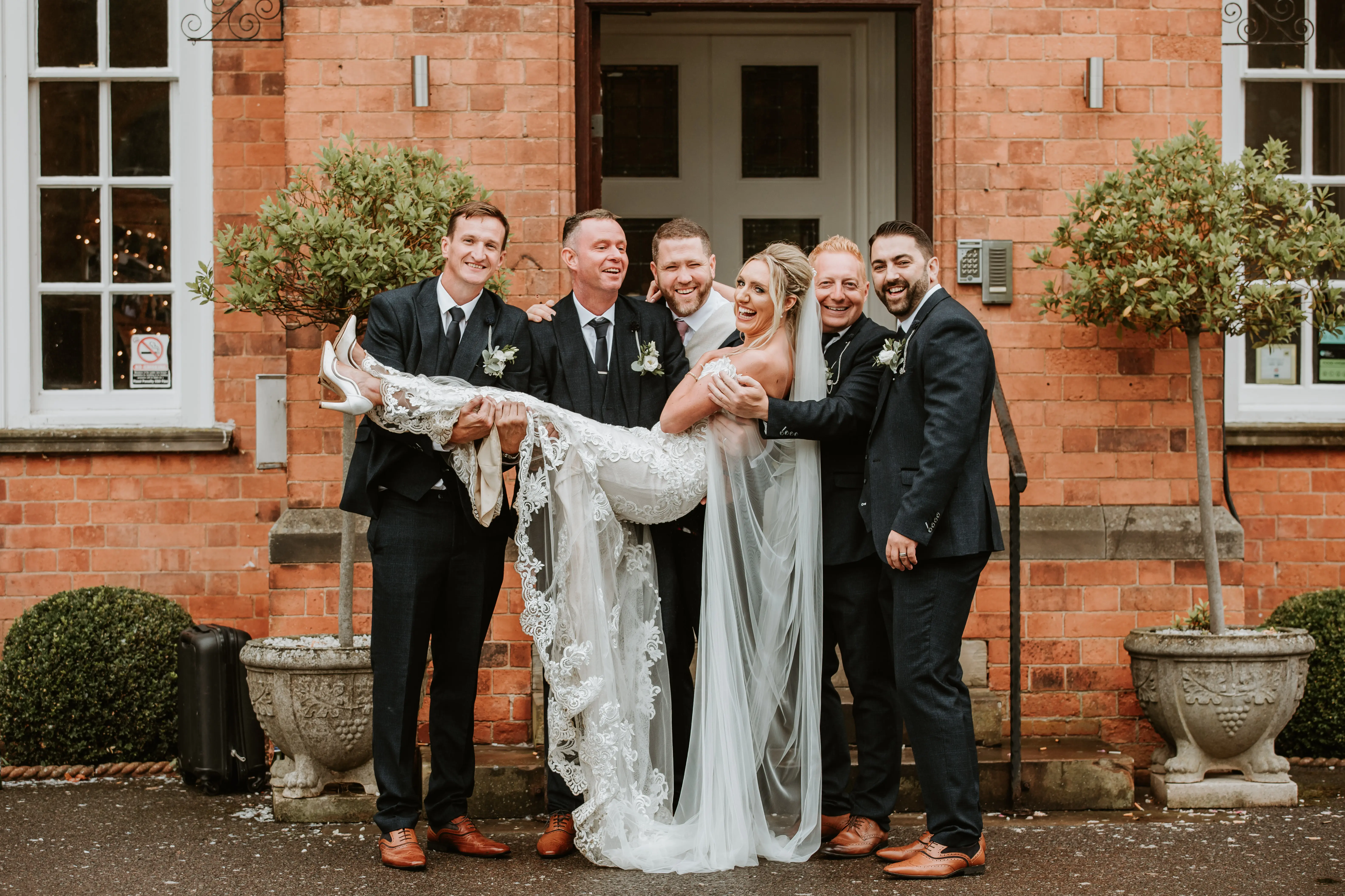 Bride In Illusion Train Edison Maggie Sottero With Groomsmen