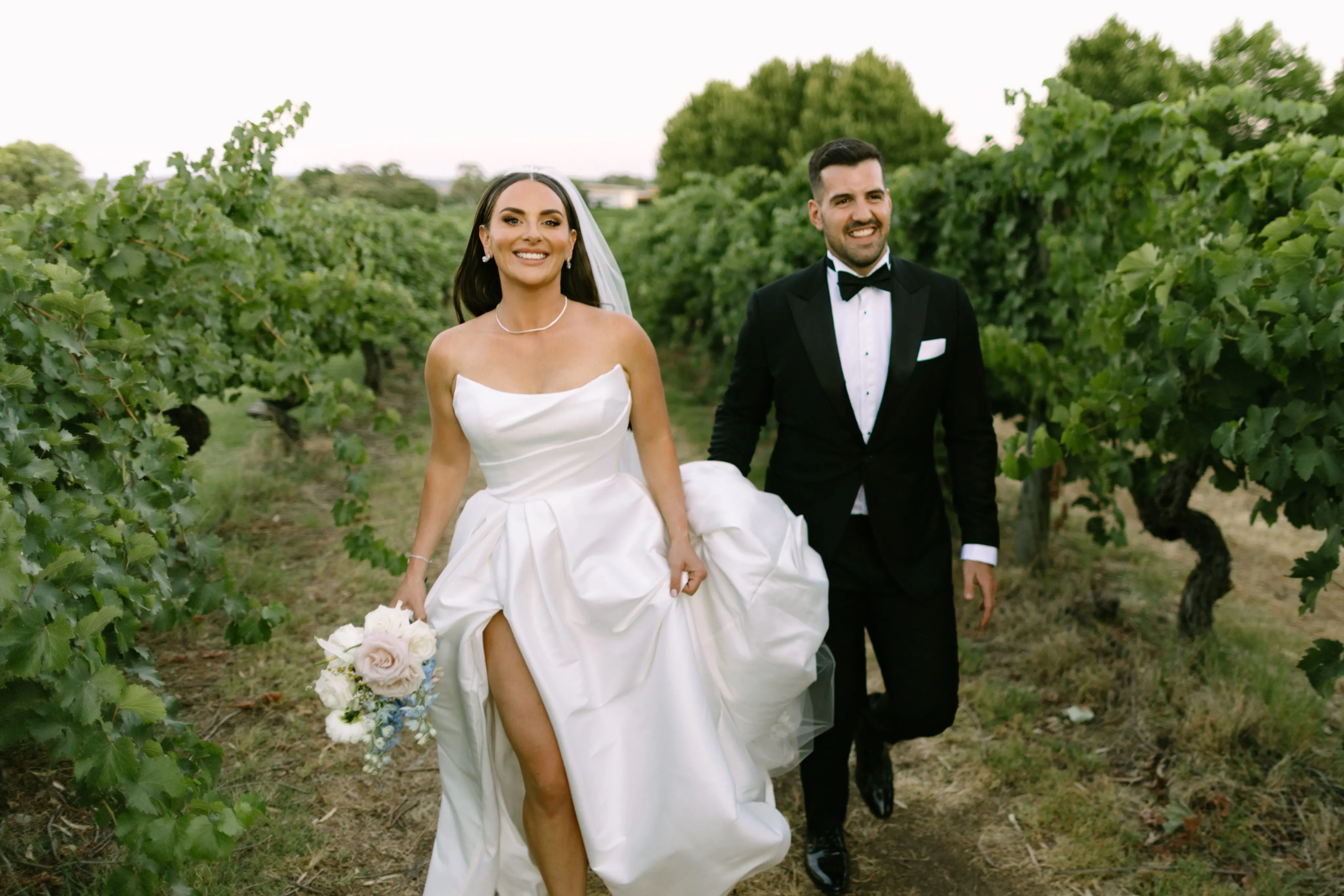 Bride wearing Aspen by Sottero and Midgley walking with her husband