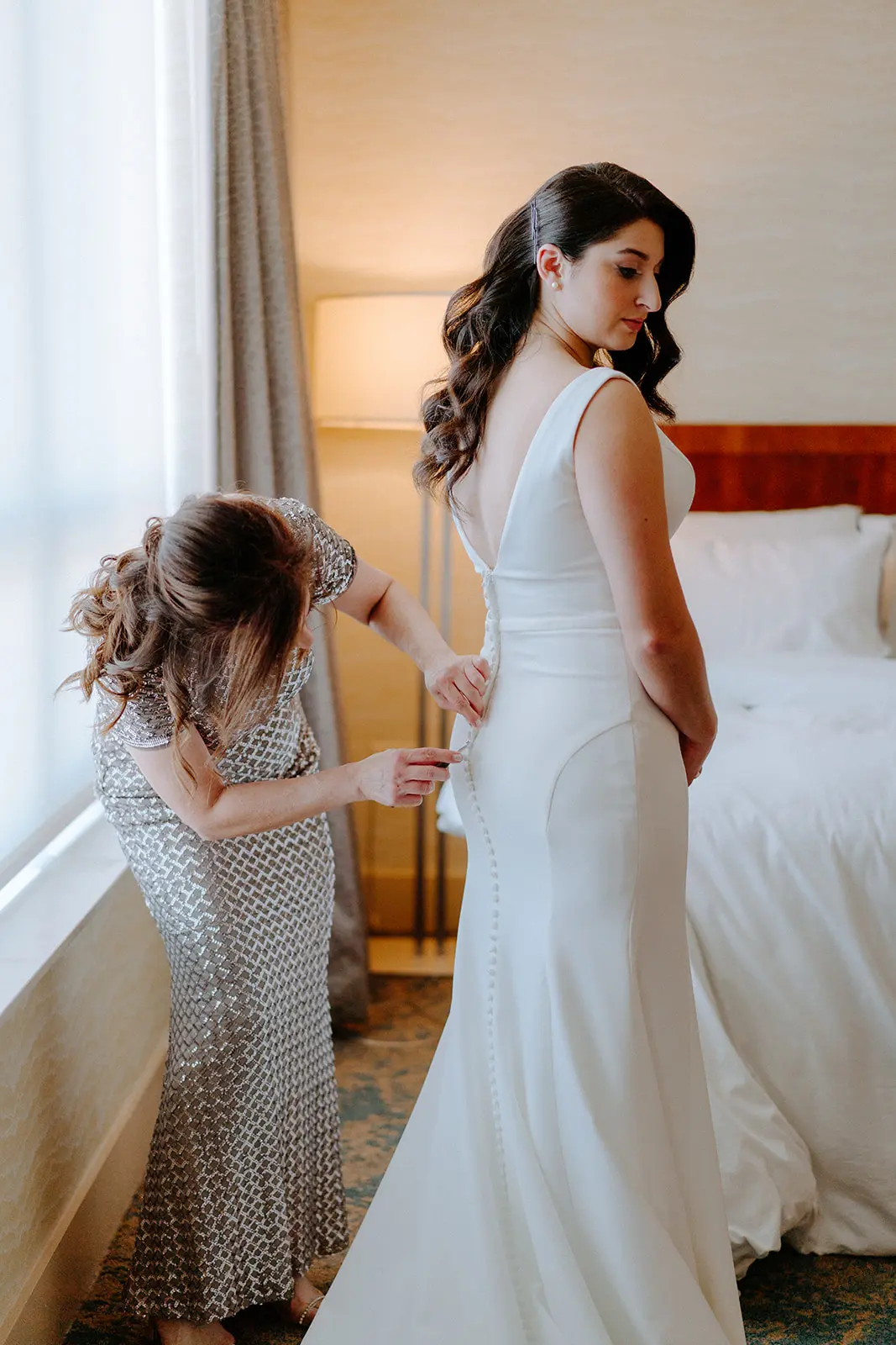 Bride Wearing Simple Wedding Dress Called Theodora By Rebecca Ingram Getting Dressed