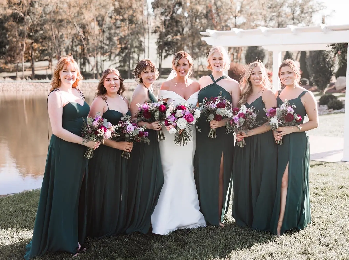 Bridesmaids In Green Smiling With Bride In Off The Shoulder Fit And Flare Wedding Dress Named Josie By Rebecca Ingram