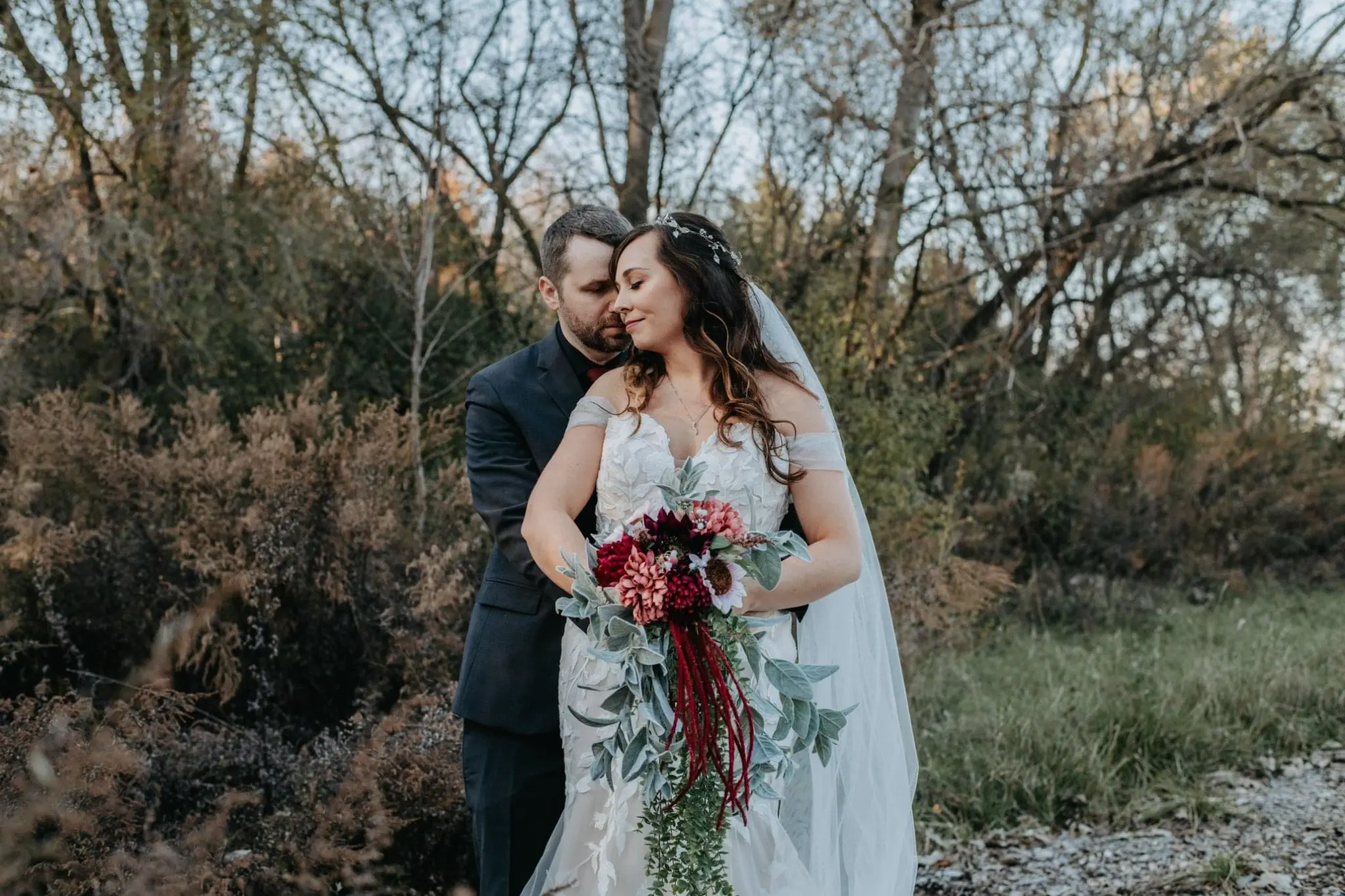 Groom with Bride in Strapless Mermaid Bridal Gown with Sweetheart Neckline Called Hattie by Rebecca Ingram