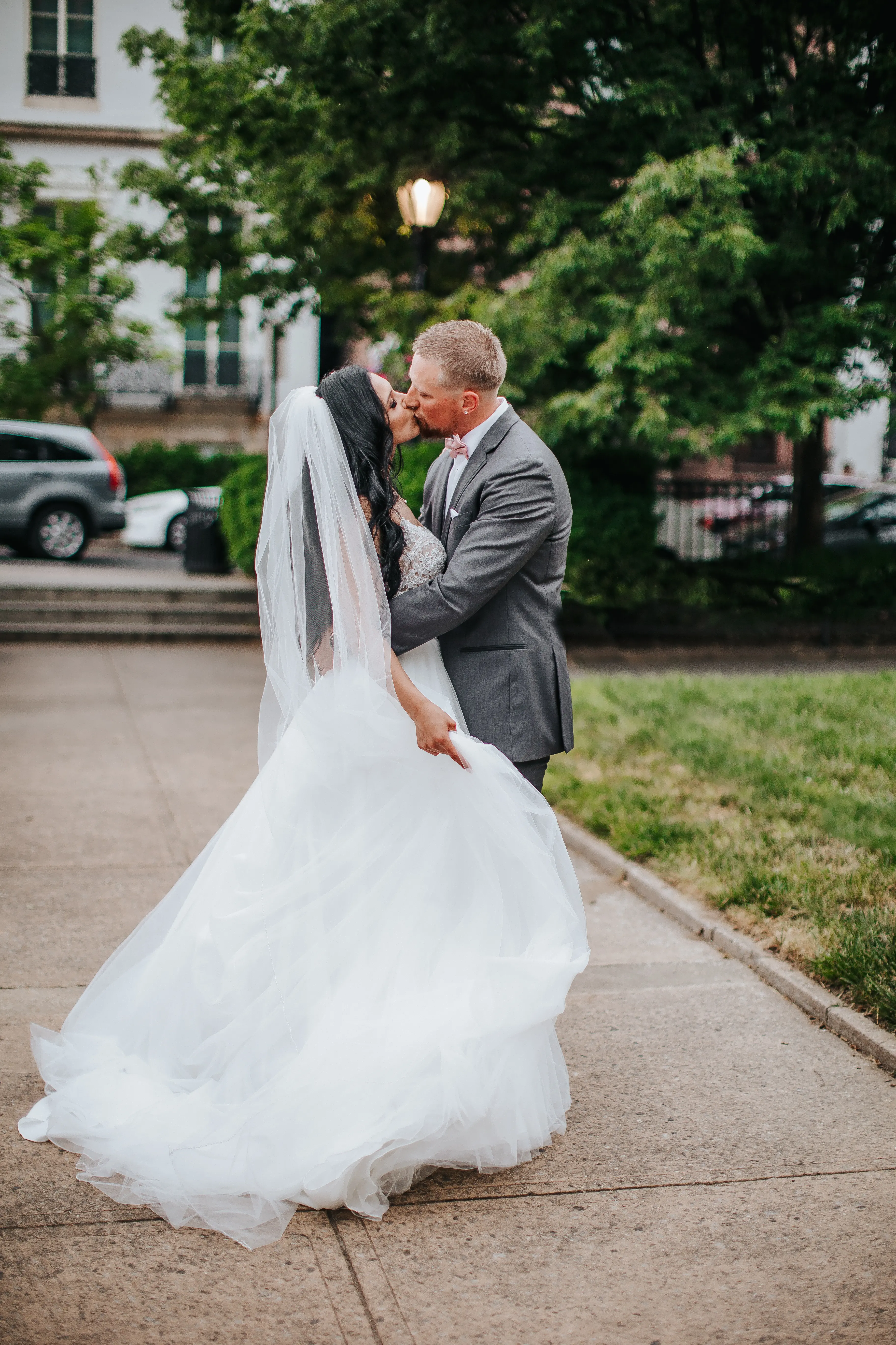 Bride with groom wearing boho princess wedding dress