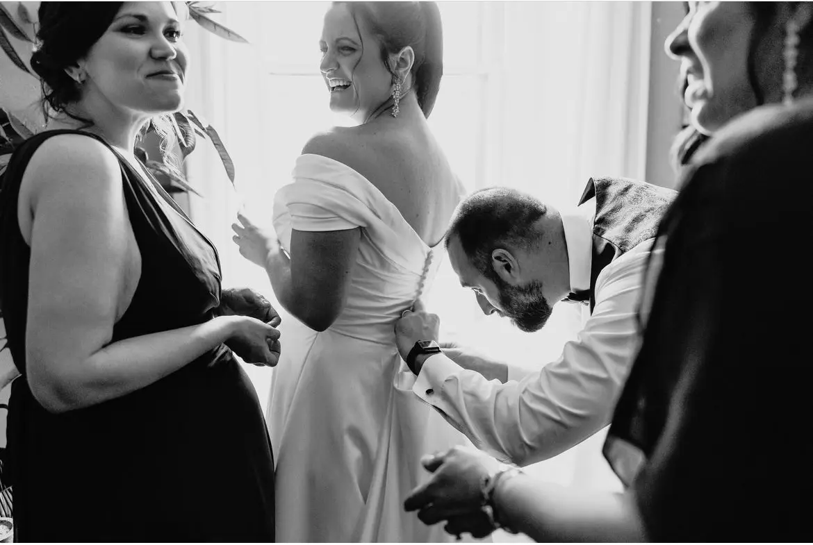 Bride wearing Ekaterina by Maggie Sottero being zipped up
