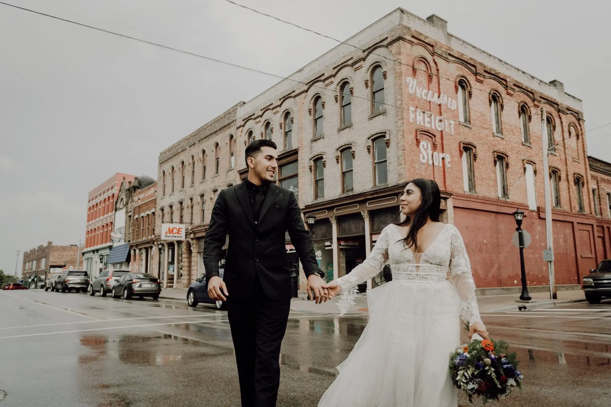 Groom and Bride Wearing Lace Aline Wedding Dress Called Raelynn by Rebecca Ingram