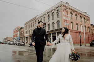 Groom and Bride Wearing Lace Aline Wedding Dress Called Raelynn by Rebecca Ingram