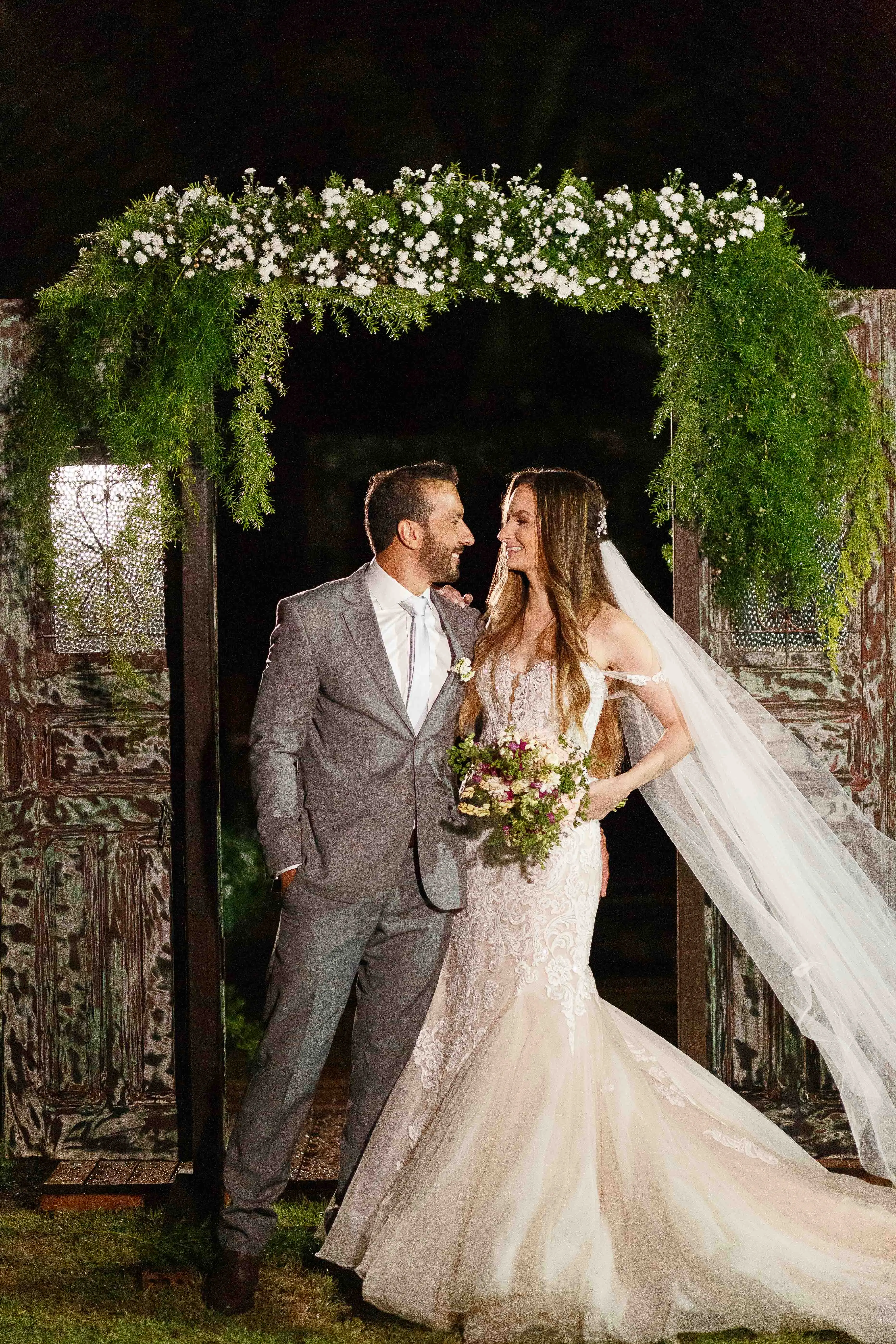 Bride in Premium Fit-and-Flare Bridal Gown with Beaded Lace Motifs Alistair by Maggie Sottero with Groom