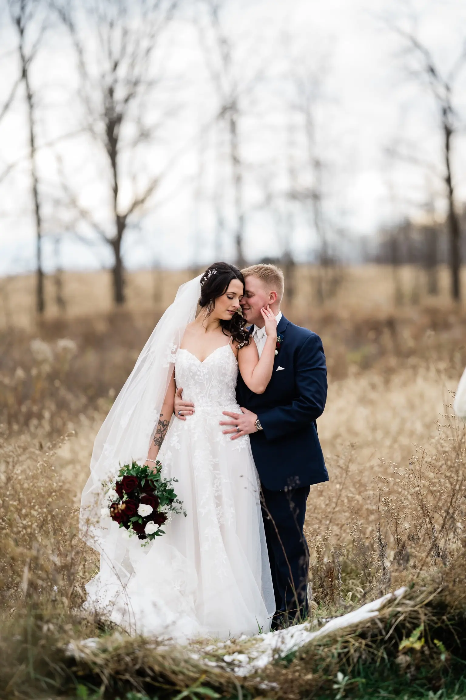 Bride Wearing Ballerina-inspired Romantic Wedding Dress Called Fairbanks By Maggie Sottero In A Field With Groom