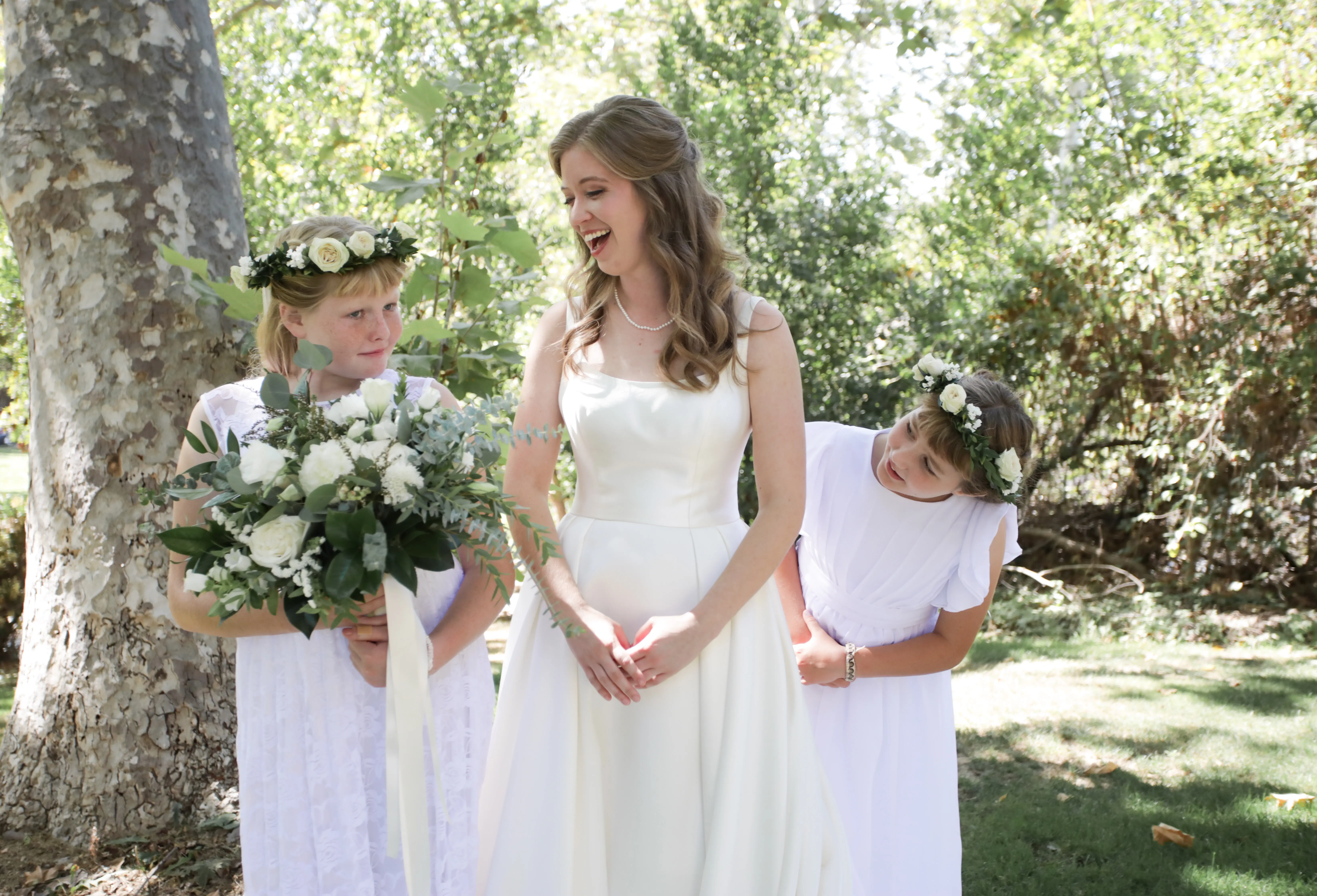 Bride wearing Simple Ballgown Wedding Dress called Selena by Maggie Sottero with her flower girls