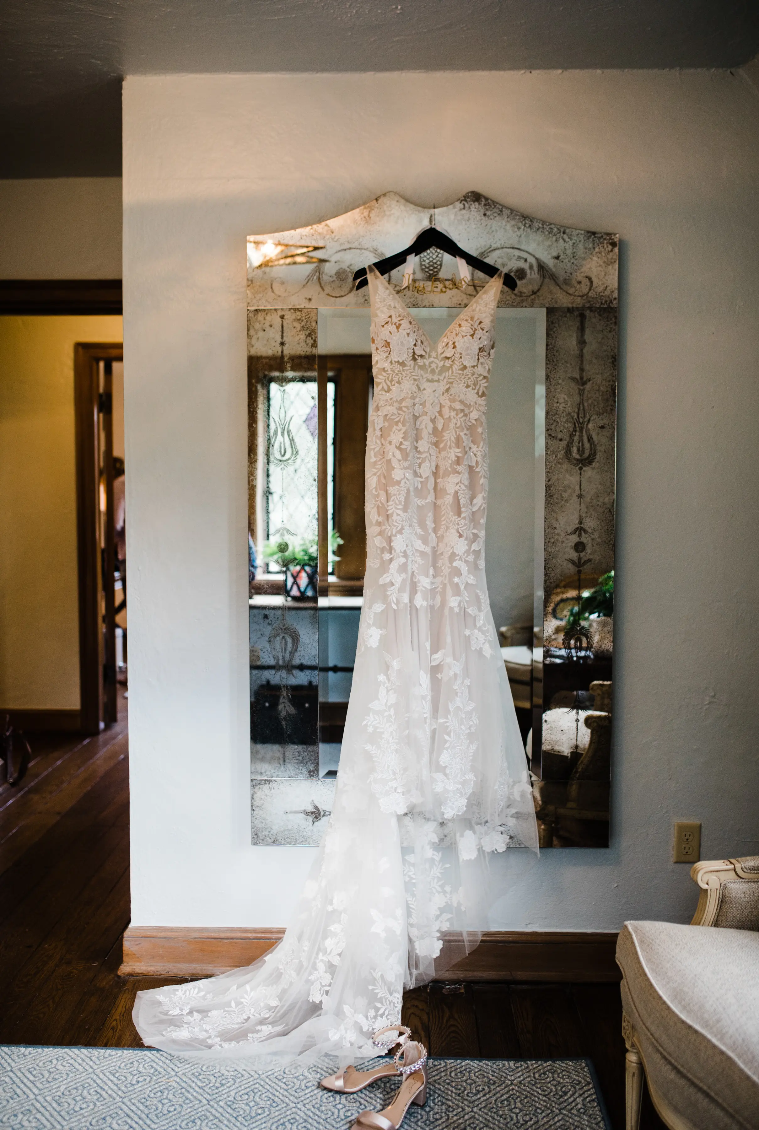 Dress On Hangar Hanging From Mirror Called Greenley by Maggie Sottero