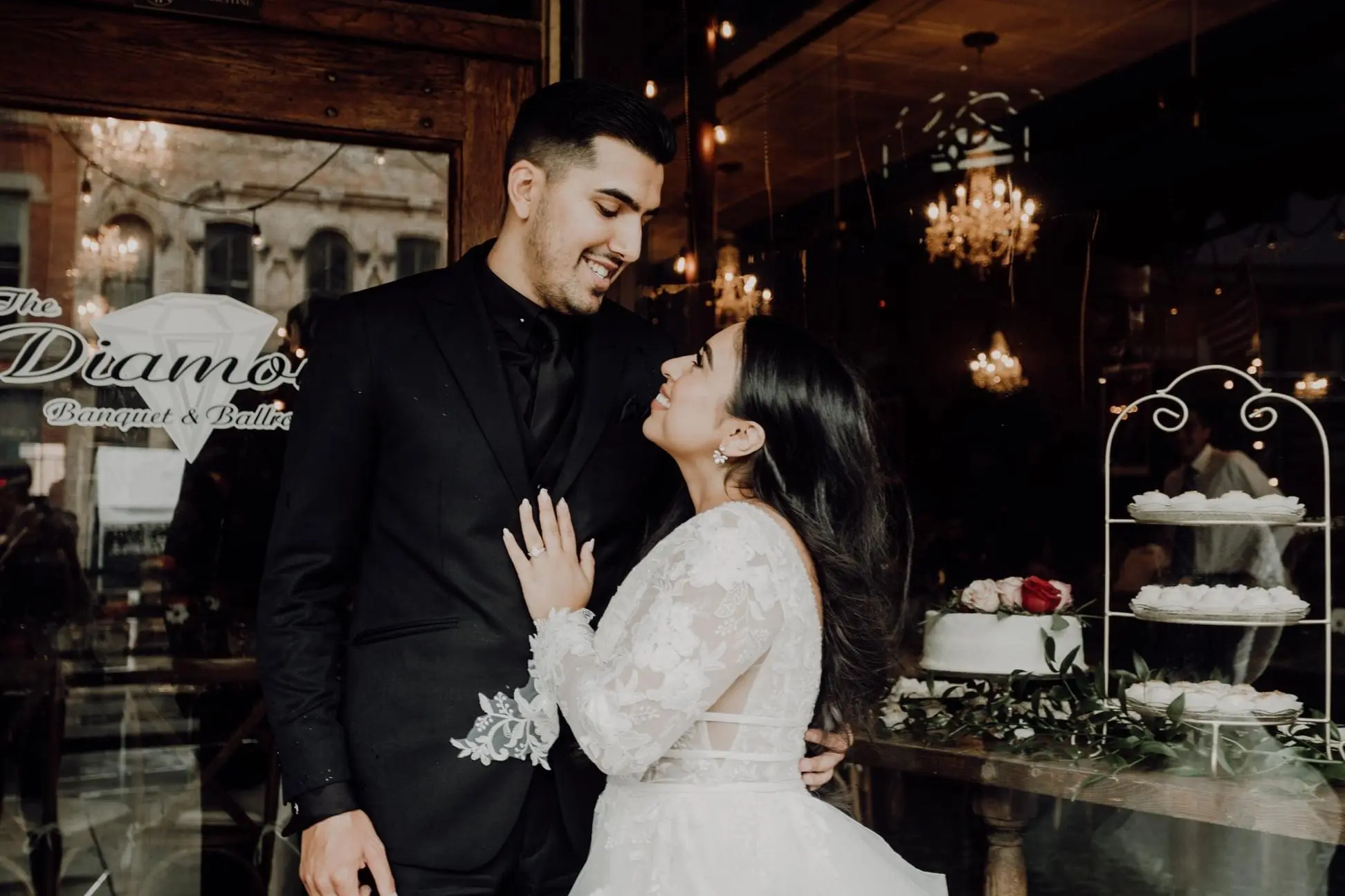 Groom and Bride Wearing Lace Aline Wedding Dress Called Raelynn by Rebecca Ingram