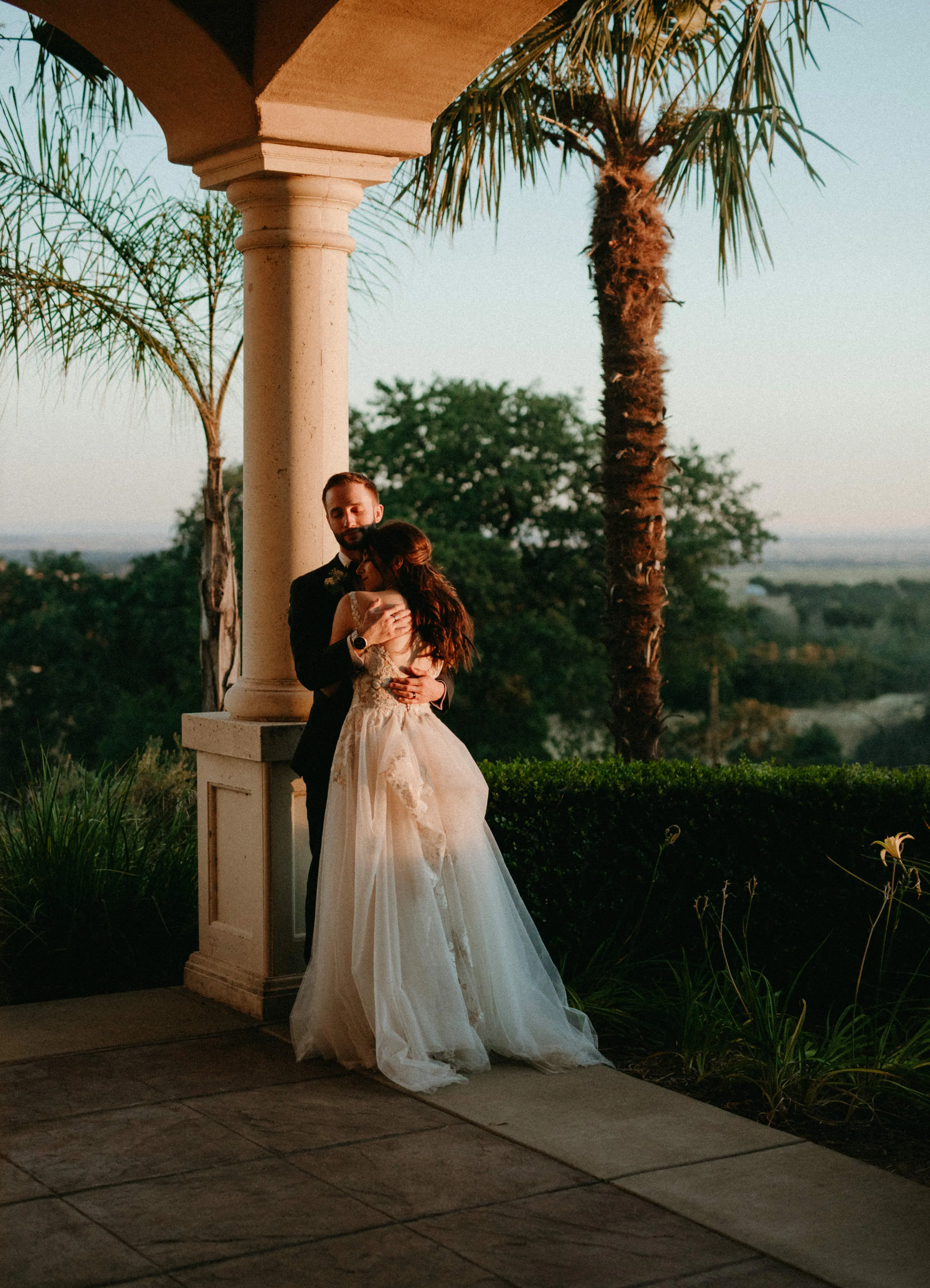 Groom Holding Bride in Magical A-Line Wedding Dress with Textured Illusion Motifs Called Minerva by Rebecca Ingram