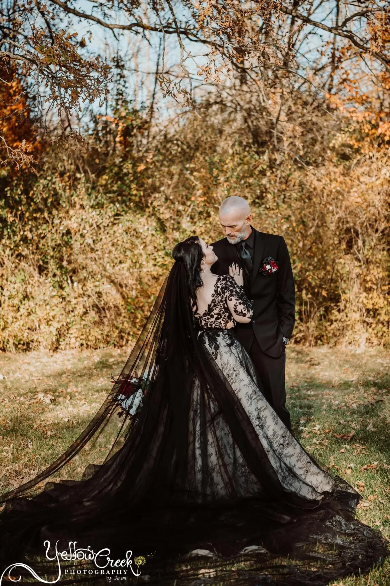 Bride And Groom Posing Together. Bride Wearing Dramatic Black Lace Ballgown Called Zander By Sottero And Midgley