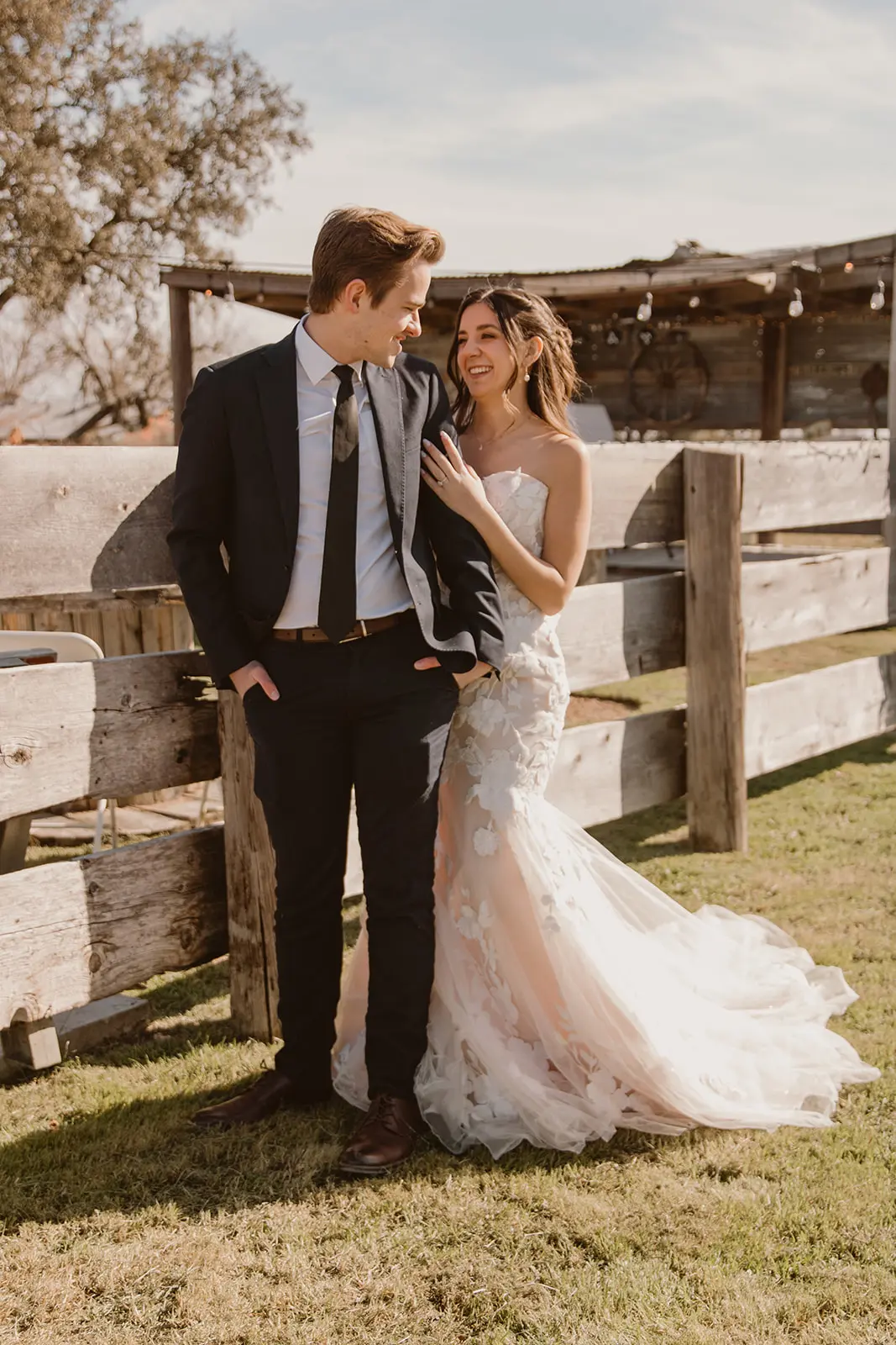 Bride wearing Bridget by Maggie Sottero smiling at her husband