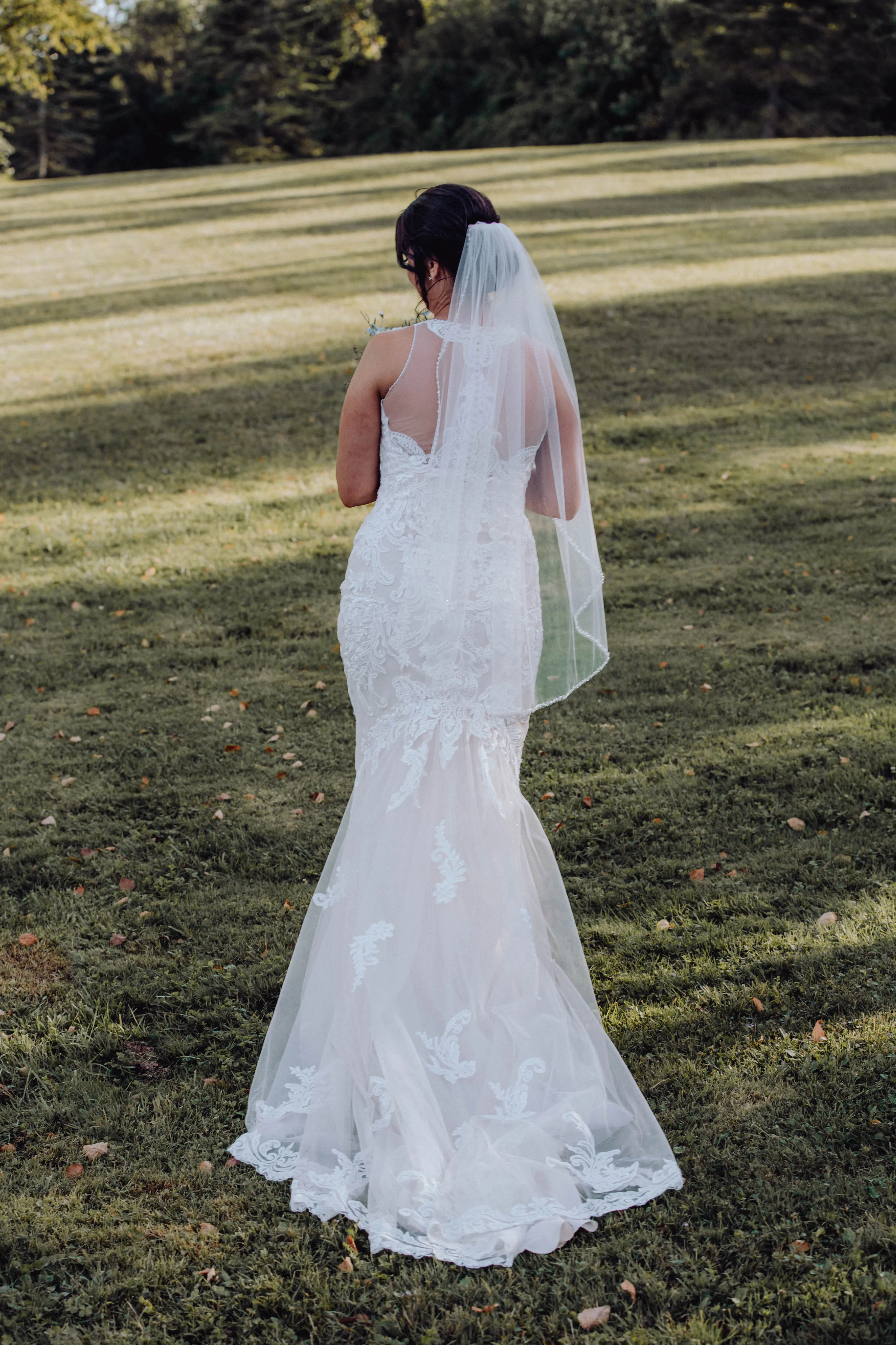 Bride wearing budget friendly fit and flare wedding dress