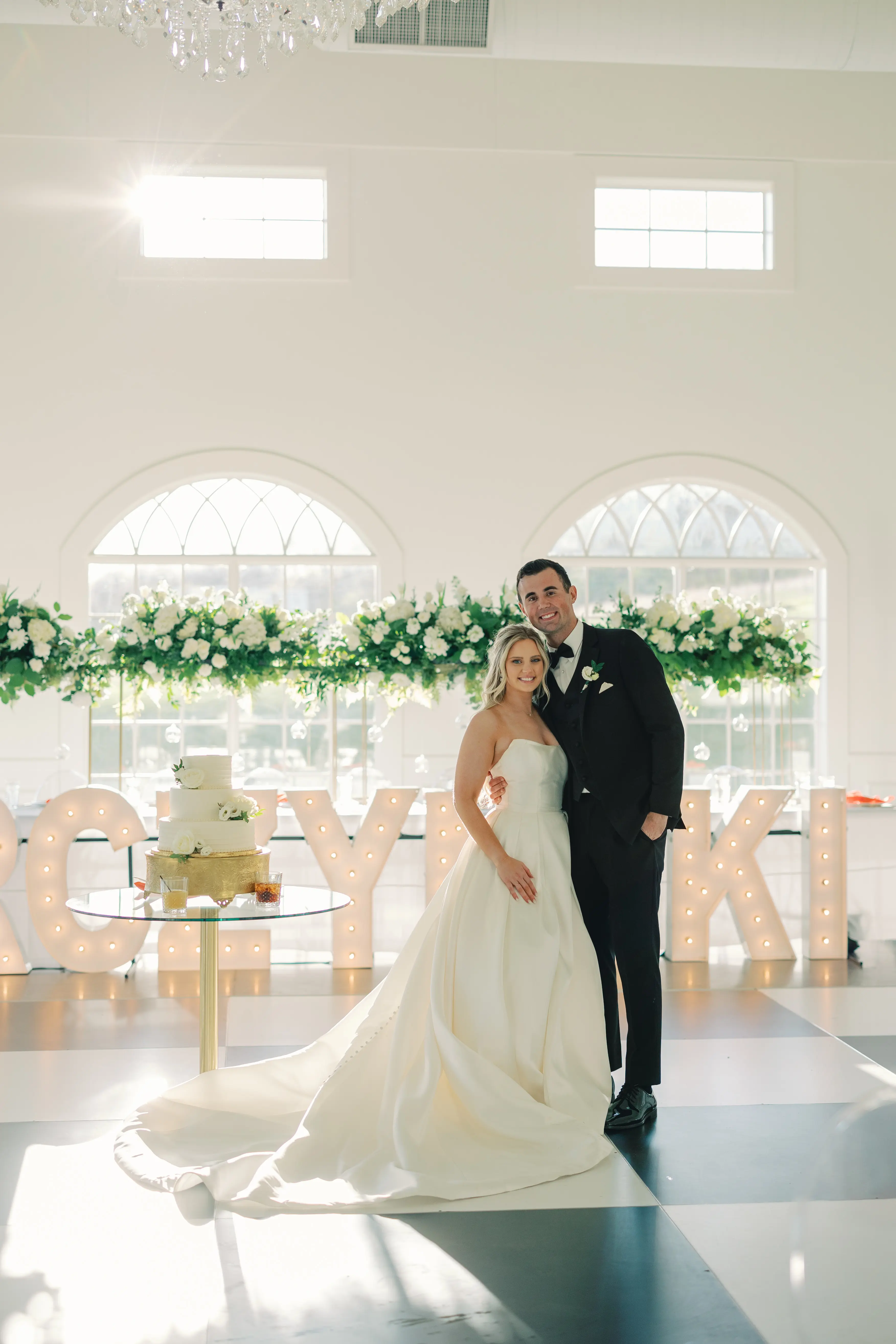 Bride wearing Selena by Maggie Sottero with her husband at their venue