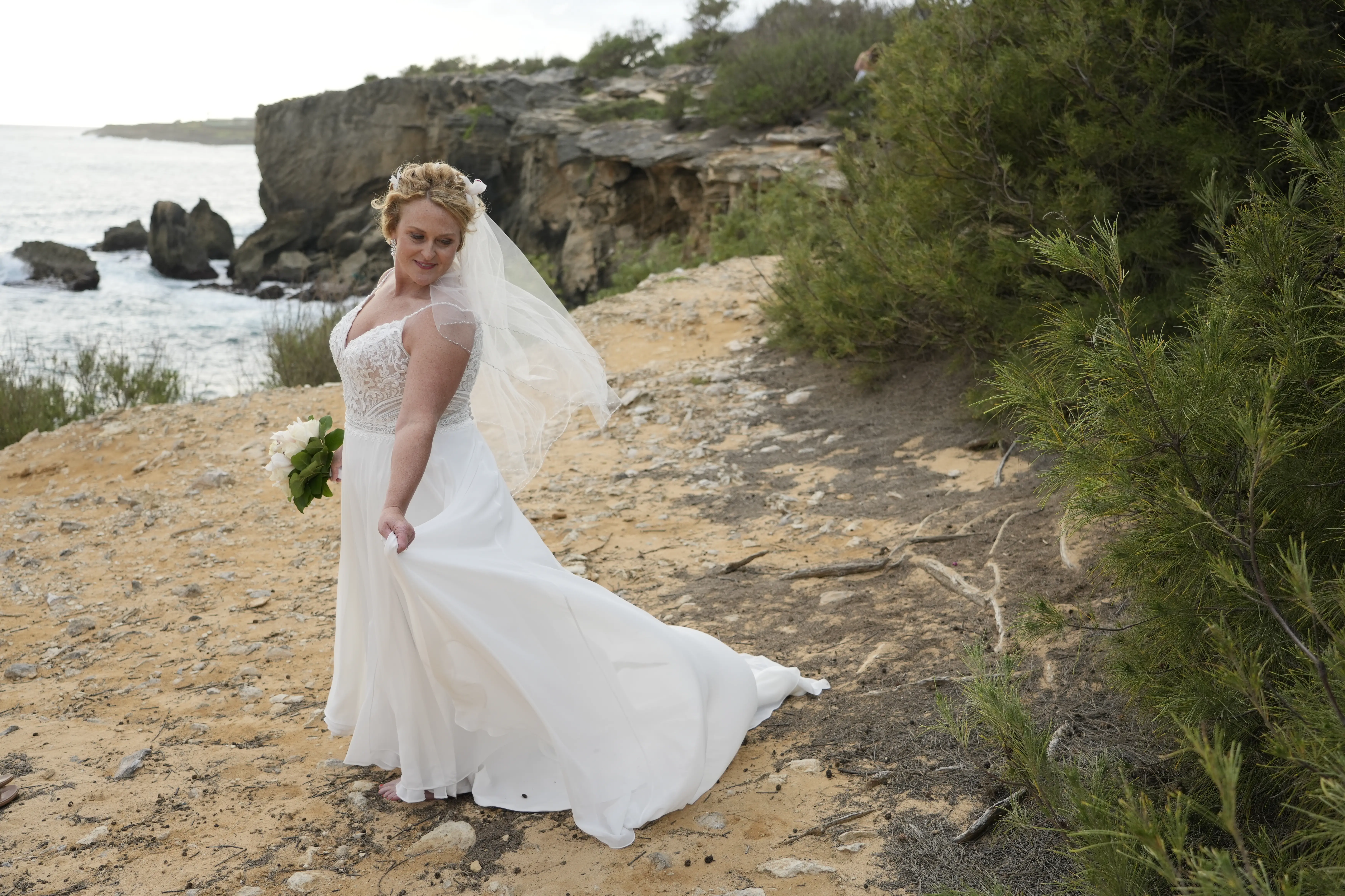 Bride wearing Lorraine wedding dress by Rebecca Ingram