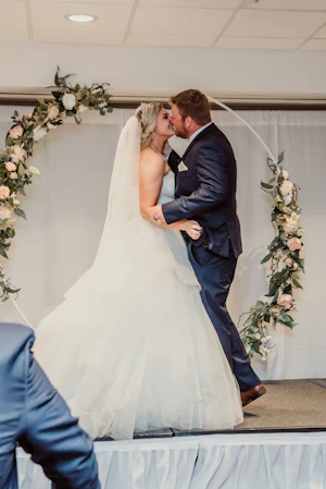Bride in tulle princess dress called Yasmin by Maggie Sottero with groom
