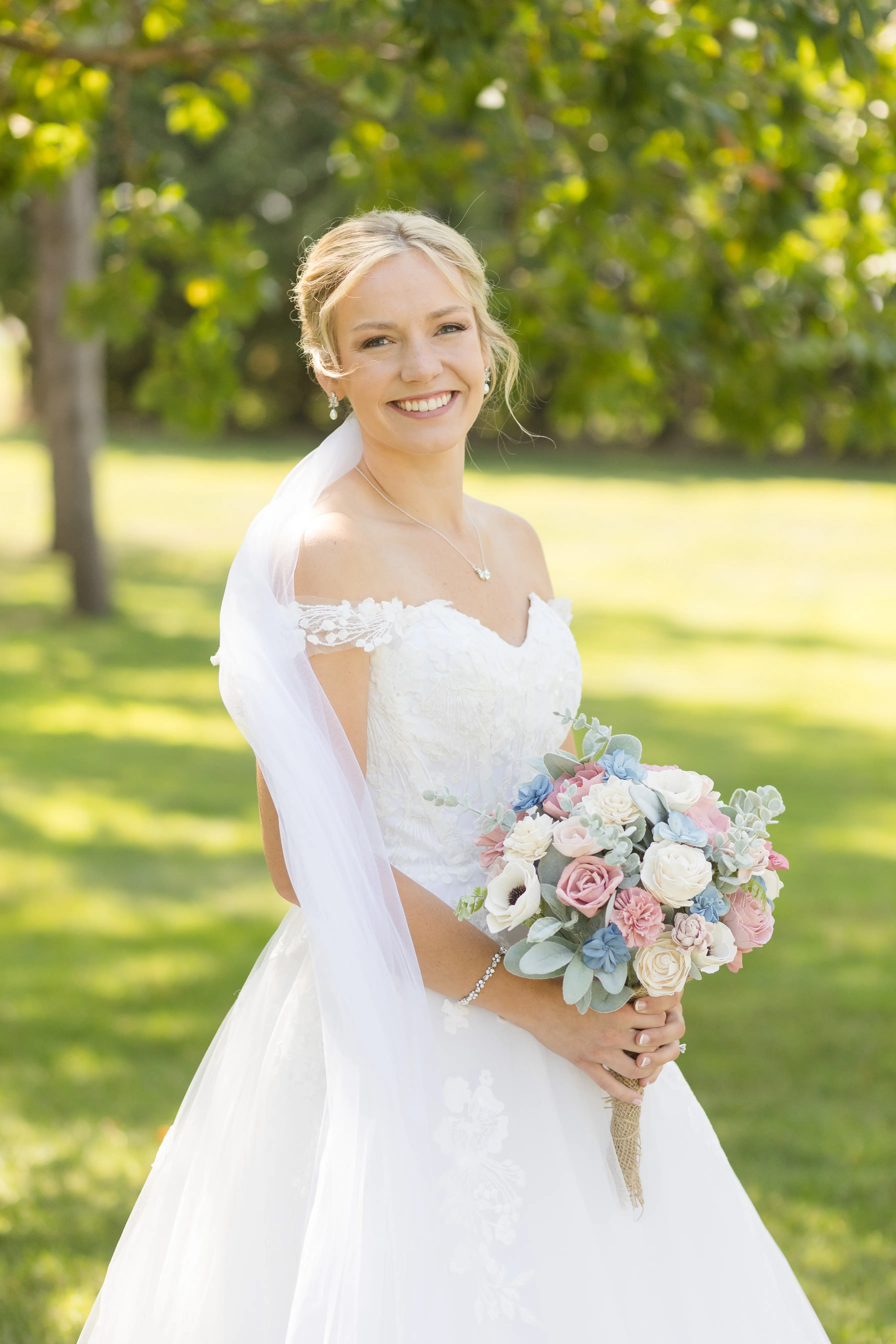Bride Wearing Ballgown Wedding Dress Called Harlem By Maggie Sottero Holding Pastel Bouquet